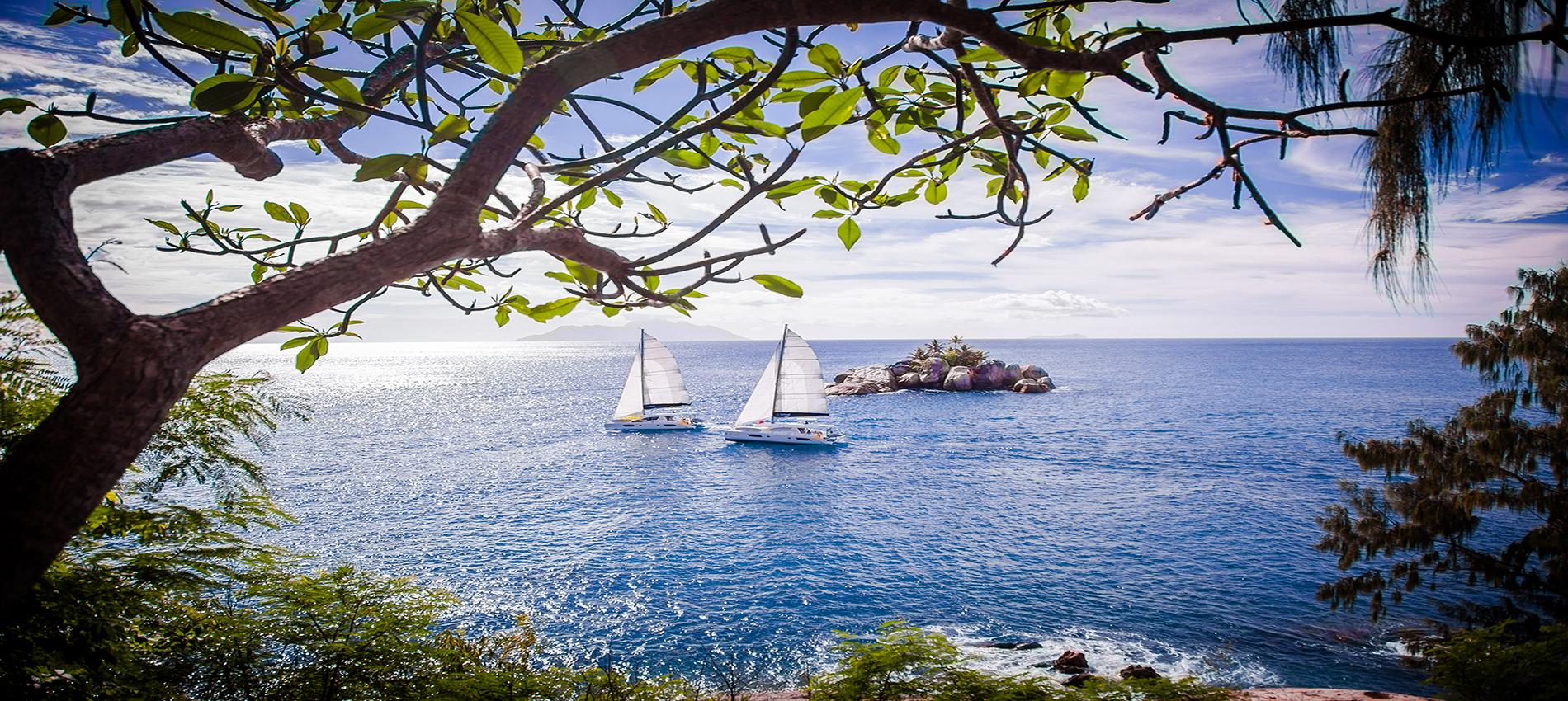 Two catamarans sailing in the Seychelles