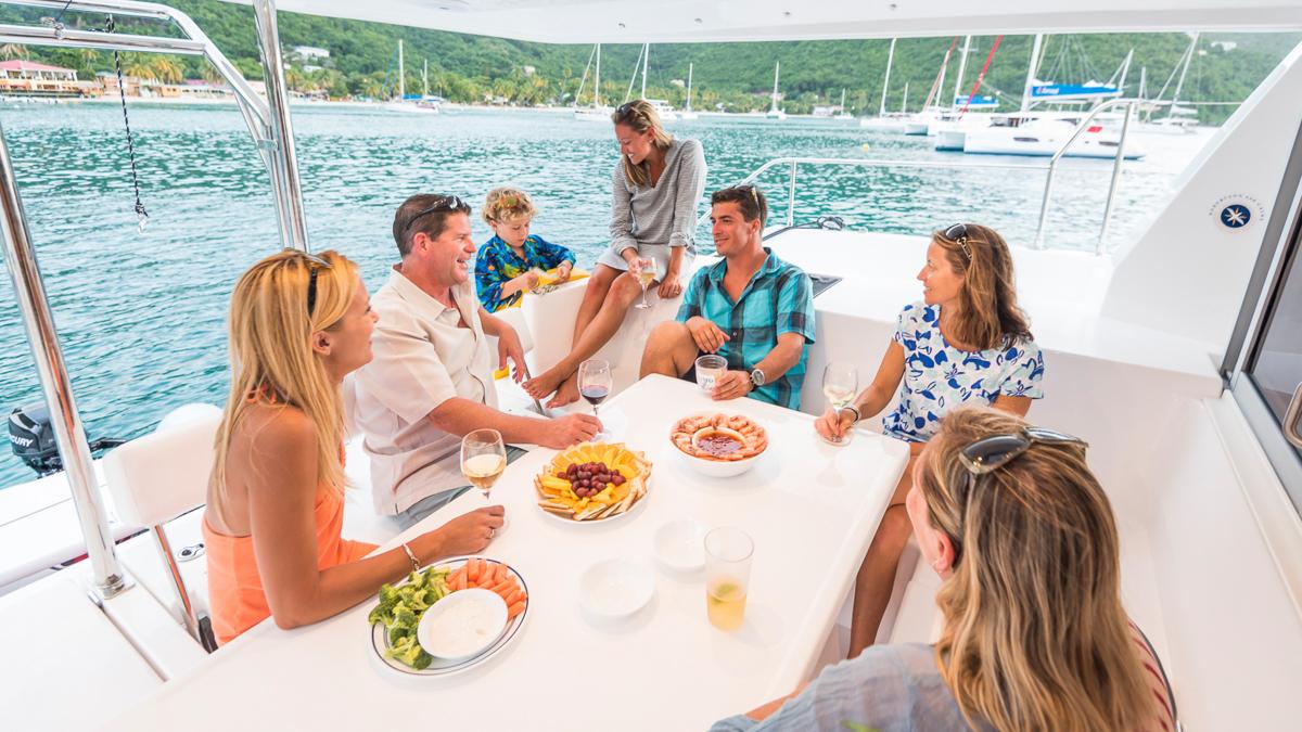 Guest on board a yacht enjoying a meal together